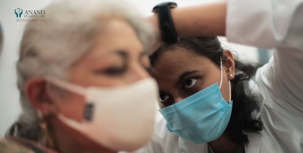 Audiologist administers a test