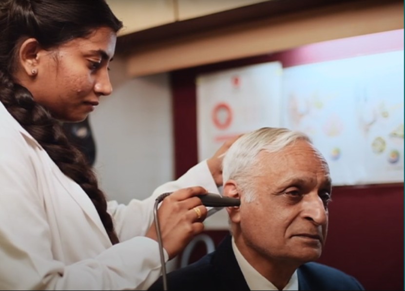 Audiologist performing a hearing test