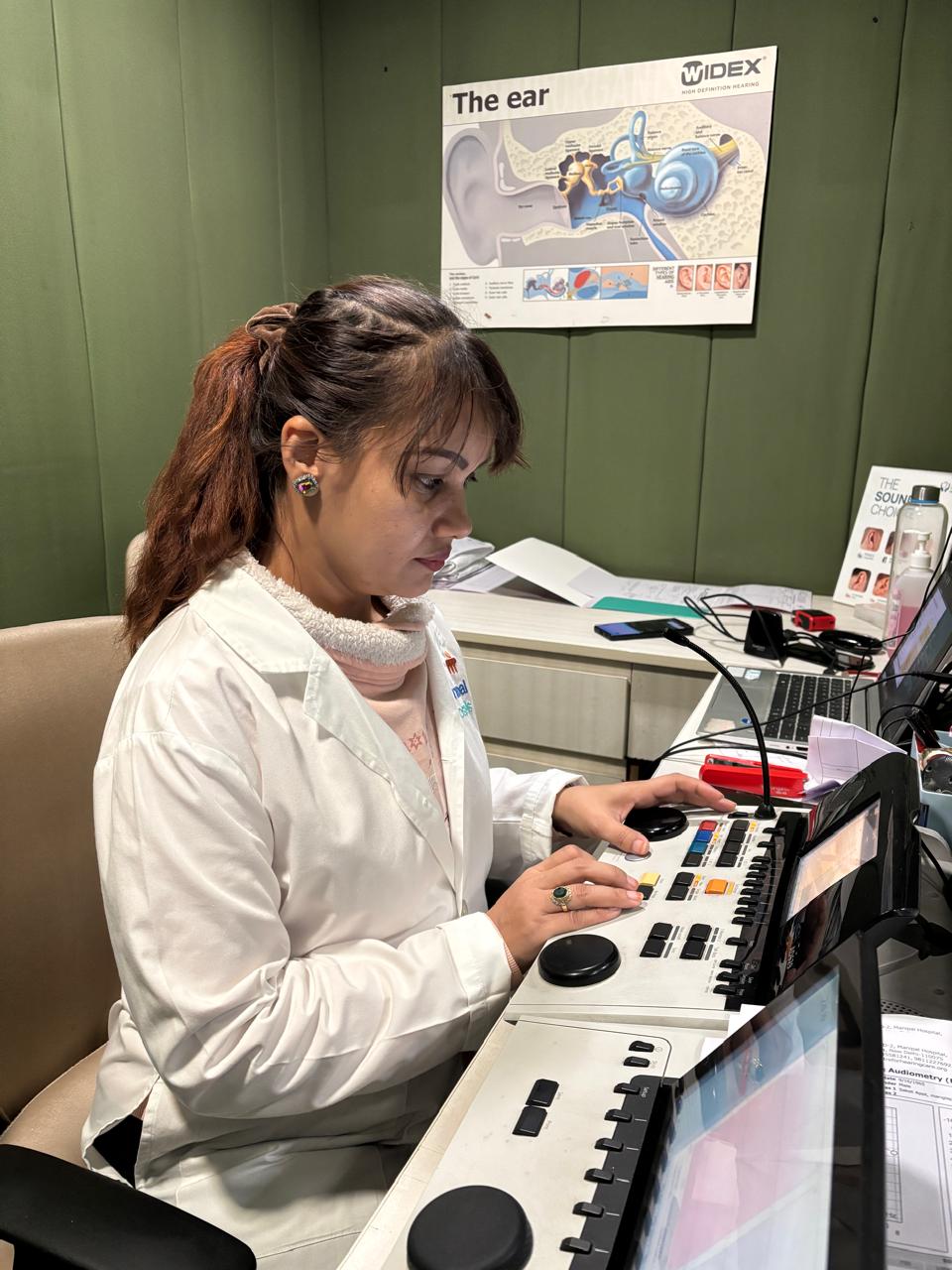 Audiologist performing a hearing test in Gurgaon