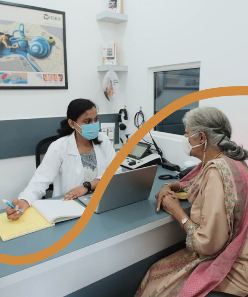 Audiologist with a patient at clinic
